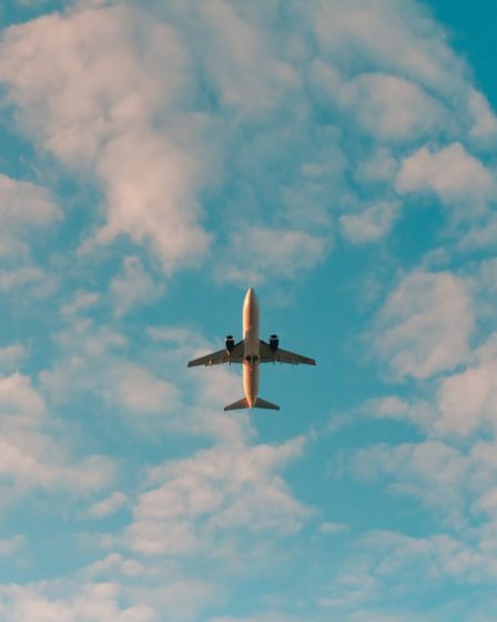 white airplane flying in the sky during daytime