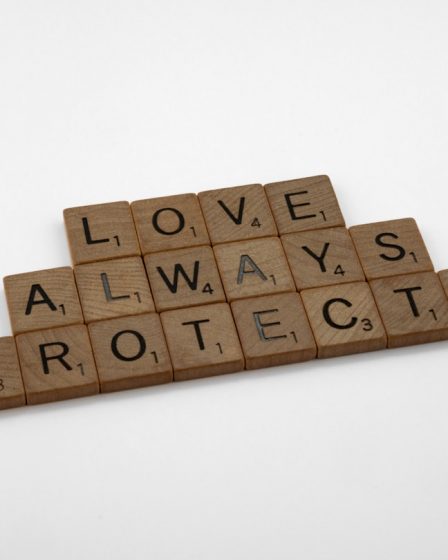 scrabble tiles spelling love, always, protect, and protect