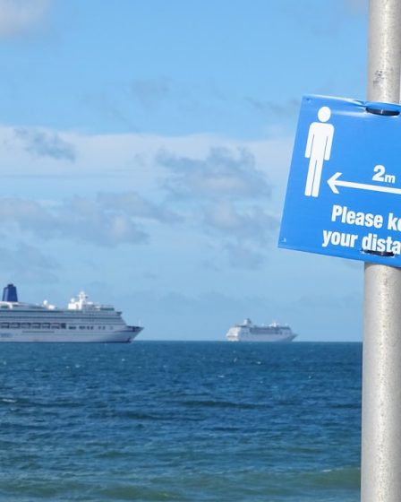 white cruise ship on sea under blue sky during daytime