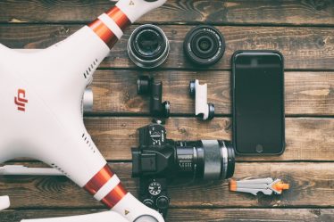 white and red DJI quadcopter drone