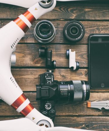 white and red DJI quadcopter drone