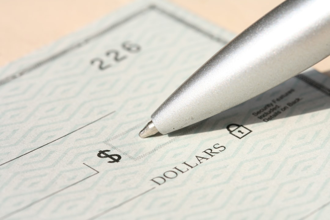 Pen poised over a check, ready to write