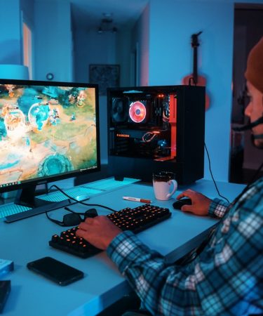 a person wearing headphones and using a computer