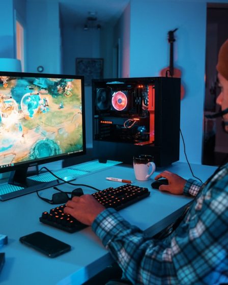a person wearing headphones and using a computer