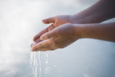 a close-up of hands shaking