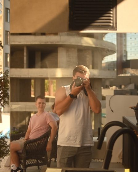 Man taking a picture reflected in a mirror