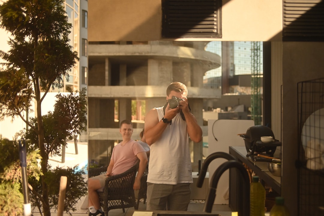 Man taking a picture reflected in a mirror