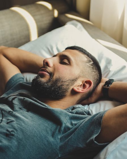 man lying on bed